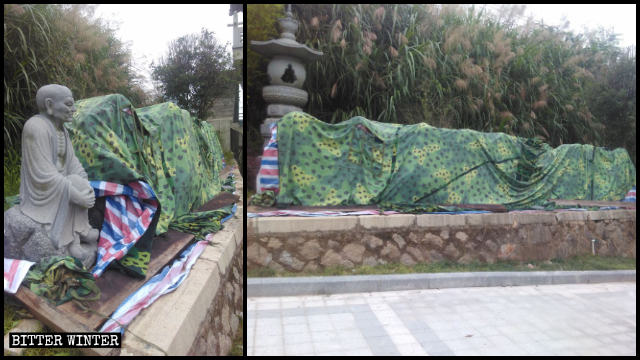 被拆除的羅漢像堆在路旁用布遮蓋